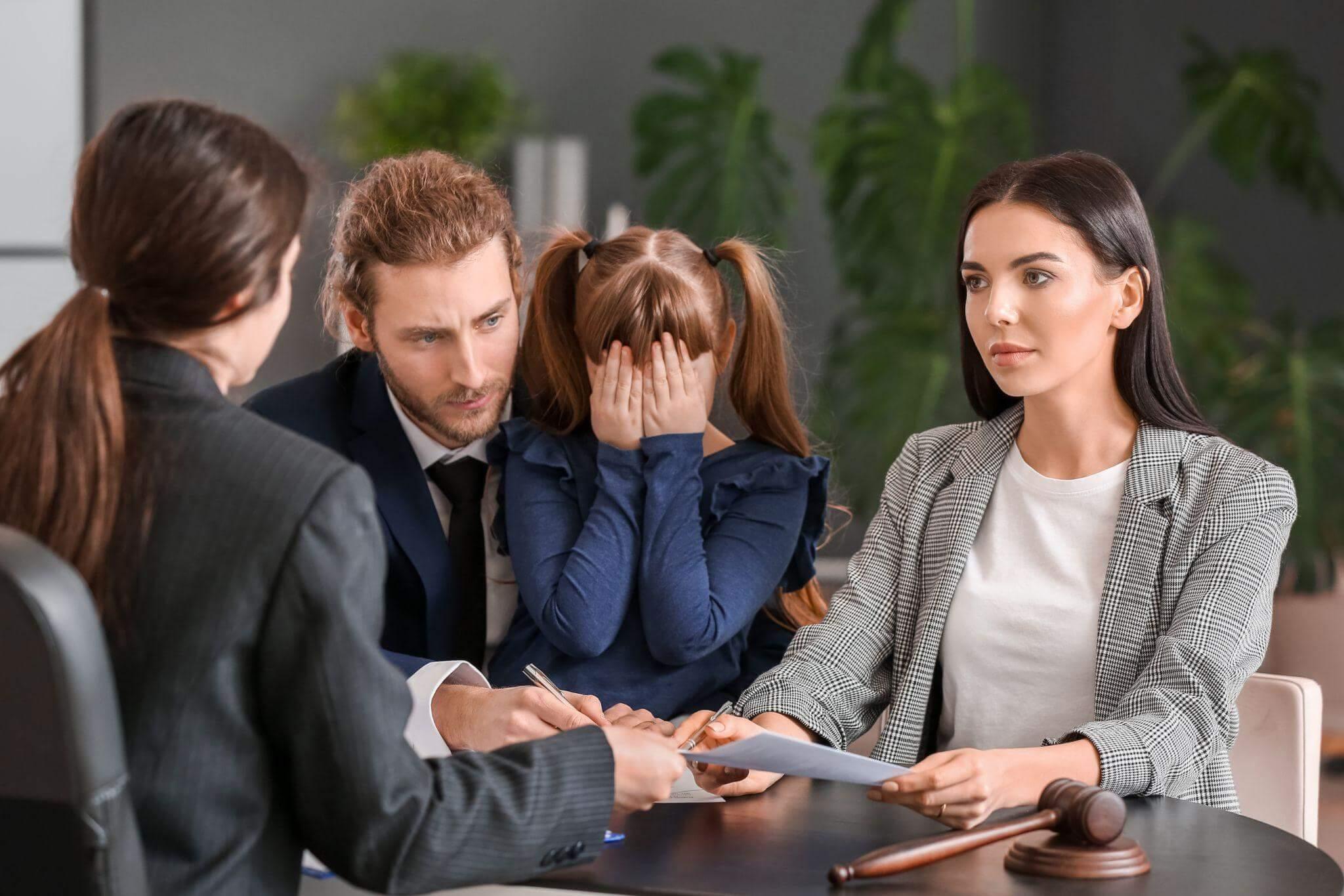a group of people sitting around a table